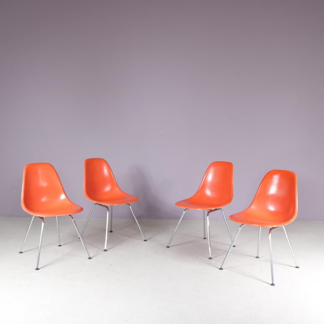 Dining Chairs in Orange Fiberglass by Charles & Ray Eames for Herman Miller, USA, 1960s, Set of 4, in Good conditions....