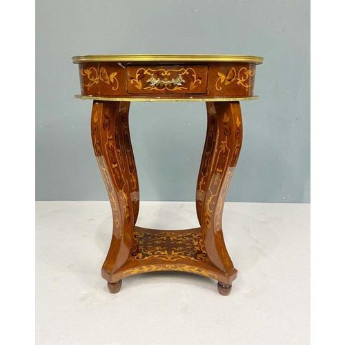 A pair of stunning Louis XV-style marquetry inlaid occasional or side tables The oval top is beautifully adorned with...
