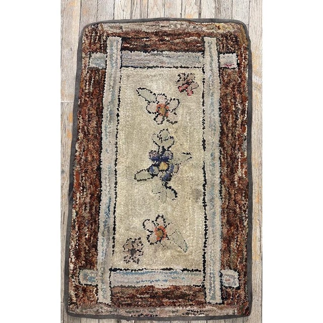 "Dating back to circa 1880, this authentic Antique American Hooked Rug is a beautiful representation of traditional North...