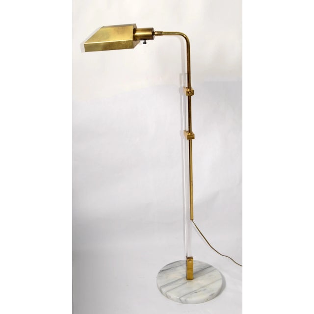 Italian 18 inches adjustable Floor Lamp of Lucite and Brass. The Lamp features a rectangular vertical shaft of solid...