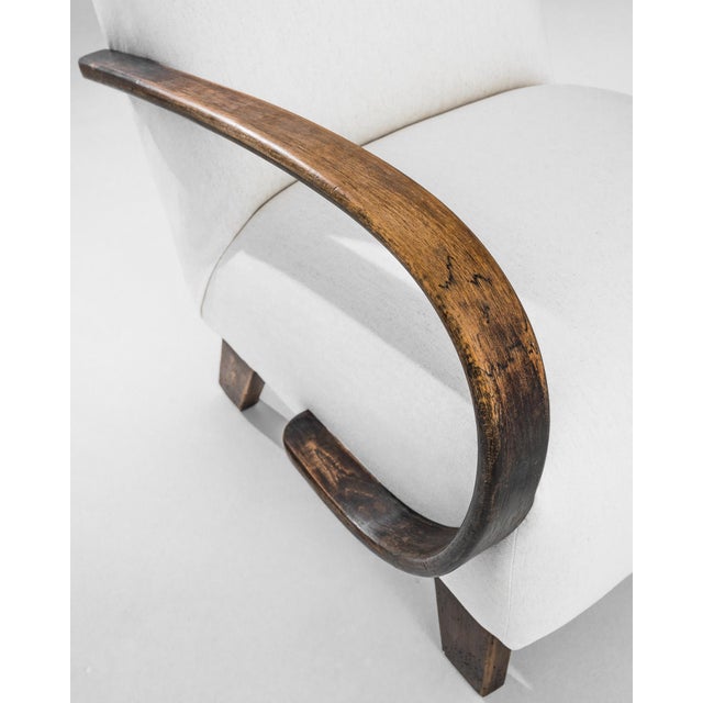 Add a touch of Art Deco elegance to your home with this stunning 1950s Czech Wooden Armchair by J. Halabala. Renowned for...