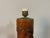 A striking Japanese carved bamboo lamp base featuring a finely executed relief of a traditional samurai warrior. The...
