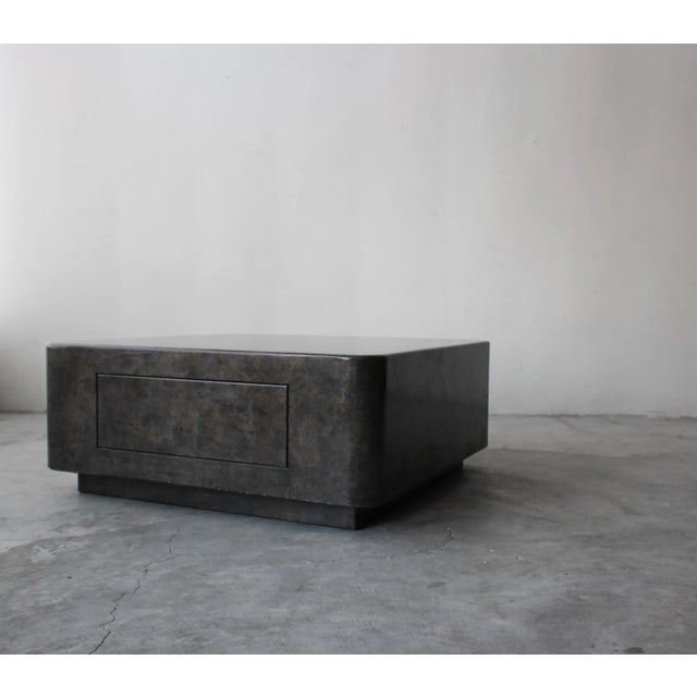 Unique post modern coffee table in dark lacquered parchment similar in style to Karl Springer. Table features a single...