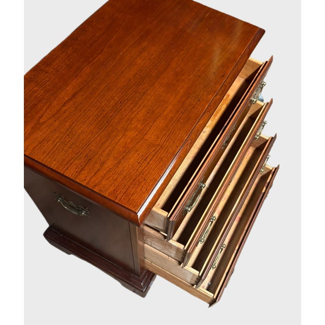 Beautiful vintage American Drew Chippendale-style chest of drawers featuring a warm, rich mahogany-toned wood finish and...