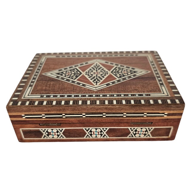 These boxes are all so special in that they display minute handwork of one artisan. This is a perfect example of the inlay...