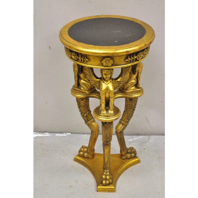 Vintage Egyptian Revival Style Gold Giltwood Round Marble Top Sphinx Pedestal Side Table Plant Stand. Item features a...