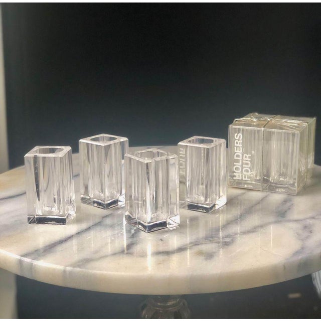 Set of four new in box lucite bud vase table setting decor. Each measures approximately 2.5” x 1.5”. Two sets available.