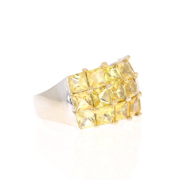 This ring has 18 Natural Square Cut Yellow Sapphires that weigh 7.39 Carats. Crafted in 14 Karat White Gold and weighs...