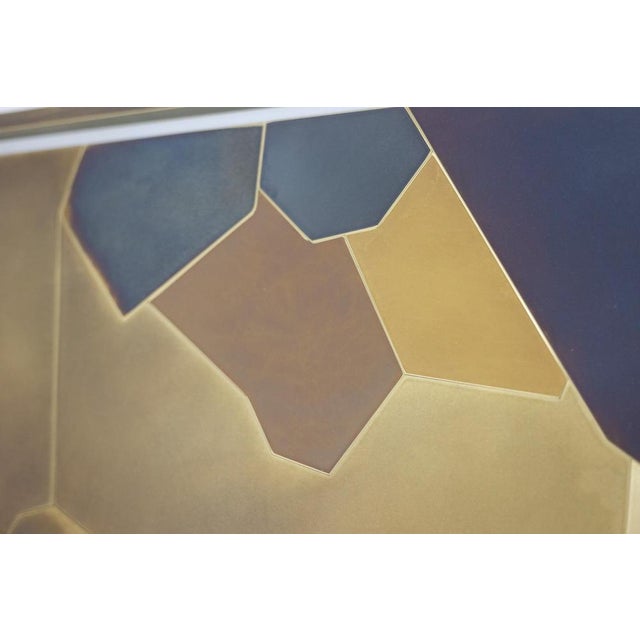 Decorative panel entitled “Fragmentations – X” in inlaid and patinated brass. Glossy varnish finish. This piece is...