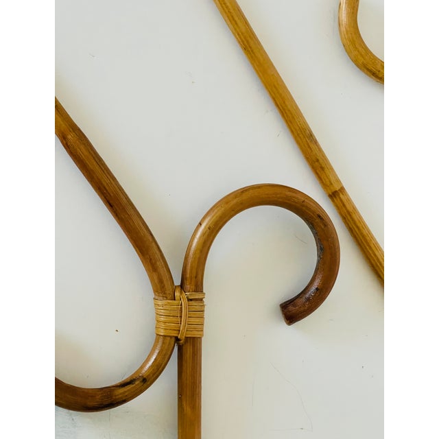 Pair of vintage mid century modern bamboo rattan wardrobe hangers.