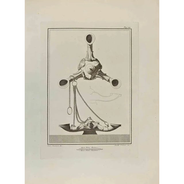 Ancient Roman Still Life from "Antiquities of Herculaneum" is an etching on paper realized by Aniello Cataneo in the 18th...