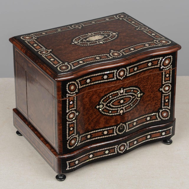 A fine 19th century French Napoleon III style tantalus, or cave à liqueur, in the style of Charles-Guillaume Diehl....