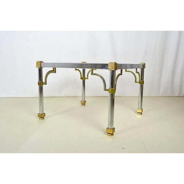 Stunning beveled glass end tables in chromed steel with brass detail. Two tables available CONDITION Very-good vintage...