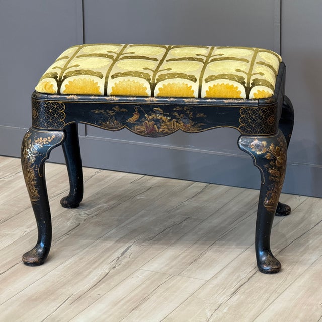 Early 19th century English footstool decorated in the chinoiserie style with detailed gilt and polychrome figures, floral...