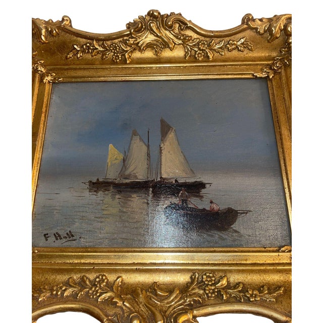 Charming set of two antique marine oil paintings, each painted by a different artist and presented in ornate gilt frames...