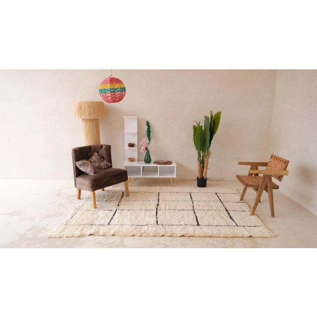 Step into a world where tradition meets contemporary allure with our Moroccan medium white / cream rug. Hailing from the...