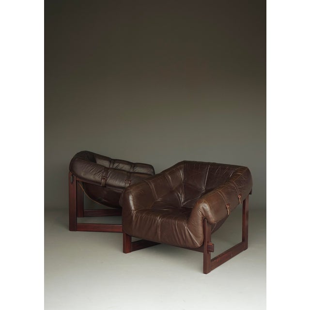 A stunning pair of MP 91 lounge chairs designed by Brazilian designer Percival Lafer and produced by Móveis Lafer. Móveis...