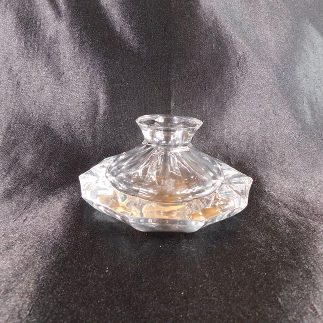 This is a ten sided, cut crystal perfume bottle with a cut crystal pointed stopper. I believe the stopper is original to...