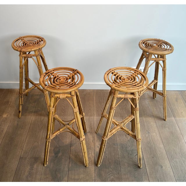 This is a rare set of 4 rattan stools. This is a French piece. Circa 1970