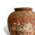 A piece of Indonesian daily life, preserved in clay. This vintage vase was handcrafted by local artisans, its warm,...