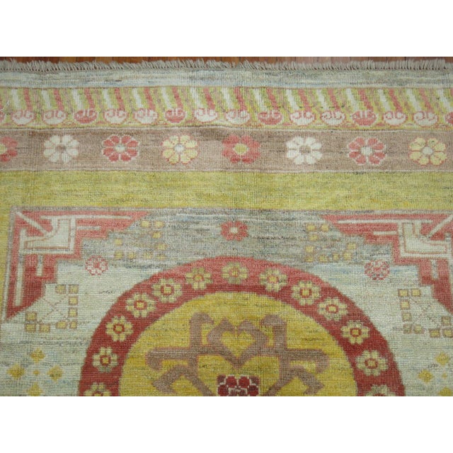 21st century vintage inspired Khotan square size rug in warm colors. 8' x'8'9''