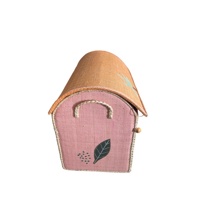 Made by unknown manufacturer ,Whimsical and artisanal, this handwoven raffia storage trunk is a standout piece for any...