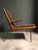 An early Boomerang chair in great vintage condition, the wood has a wonderful grain. The high quality wool upholstery is...