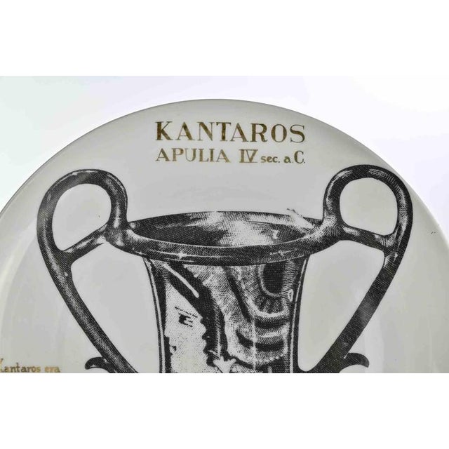 Kantaros Apulia is an elegant silk-screened porcelain plate, designed by Piero Fornasetti for Martini & Rossi in 1960s ....