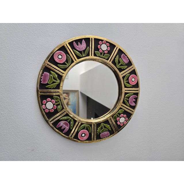 A beautiful glazed ceramic wall mirror by Mithé Espelt, a renowned French ceramicist known for her refined, colorful, and...