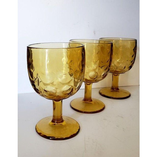 This fabulous barware, produced by Bartlett Collins in the mid-century, is beautiful amber pressed glass goblet that...