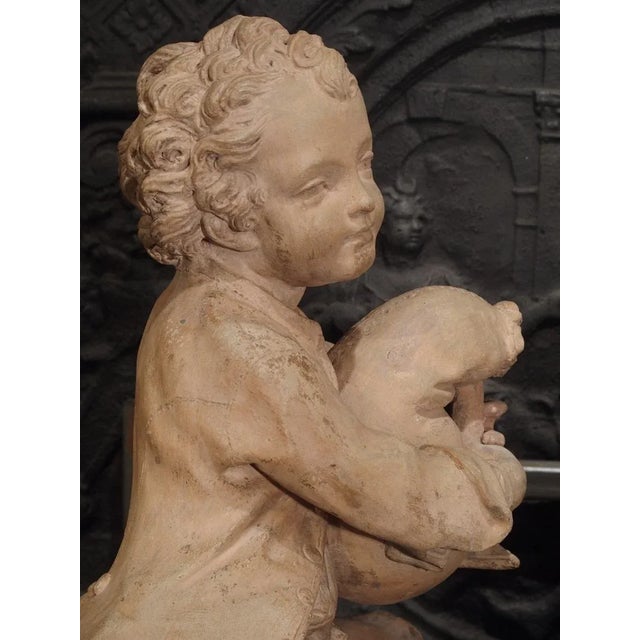 This charming pair of French terra cotta statues depicts a male and female musician and was made during the latter half of...