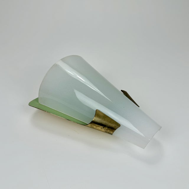 Mid-Century Italian Wall Lamp in the style of Stilnovo, 1950s, in Good conditions. Designed 1950 to 1959 This piece is...