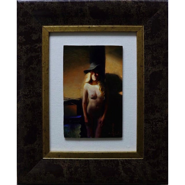 This oil on panel artwork captures a solitary figure bathed in the warm, muted tones of dusk. The interplay of light and...