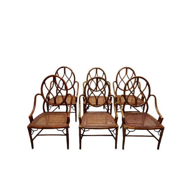 Beautiful Set of Mid-Century Modern McGuire Bamboo and Rattan Dining Chairs This exquisite set of dining chairs is a...