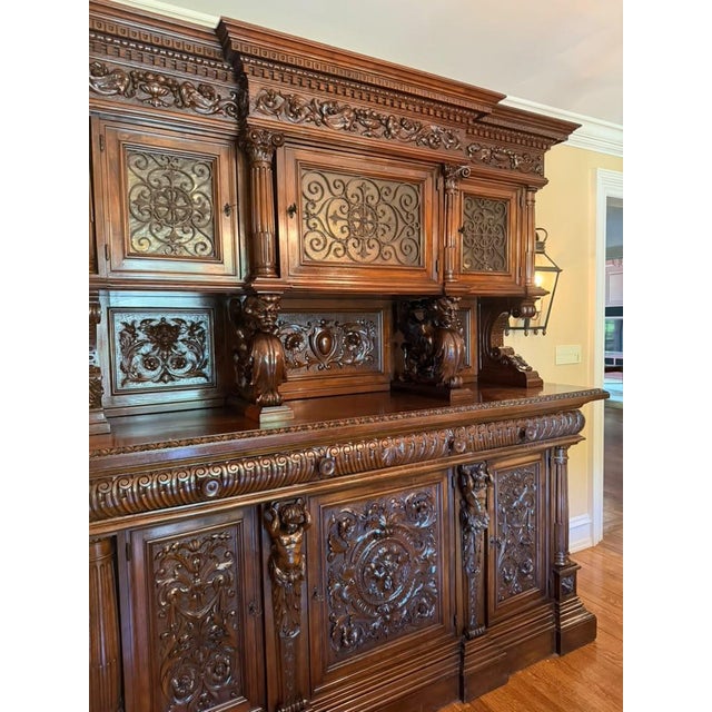 An impressive French mid-19th-century Rococo-style walnut buffet, circa 1850–1860, featuring elaborate hand-carved...
