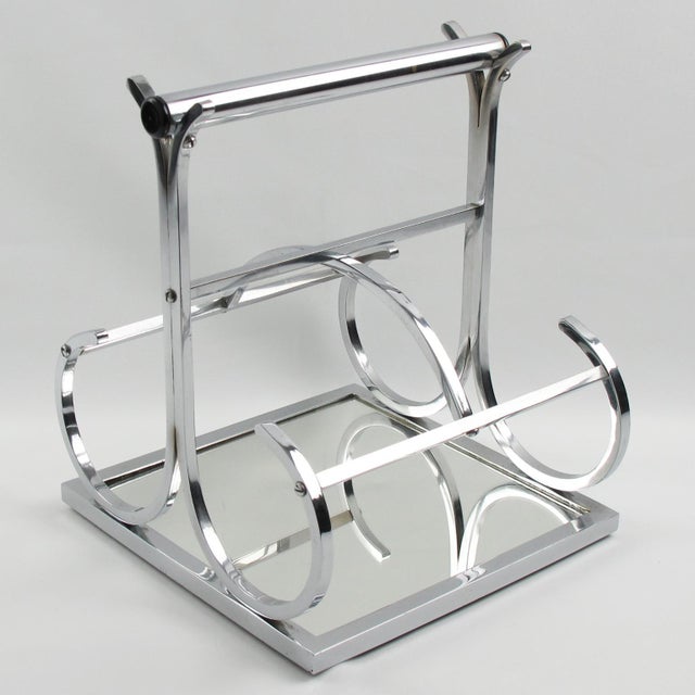 French designer Jacques Adnet (1901 - 1984) designed this elegant Art Deco modernist wine bottle carrier or holder. The...