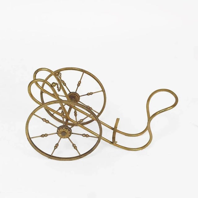 Bottle rack in gilded brass, Italy, 1950s by Aldo Tura. This wine rack is very unique as the main structure is sustained...
