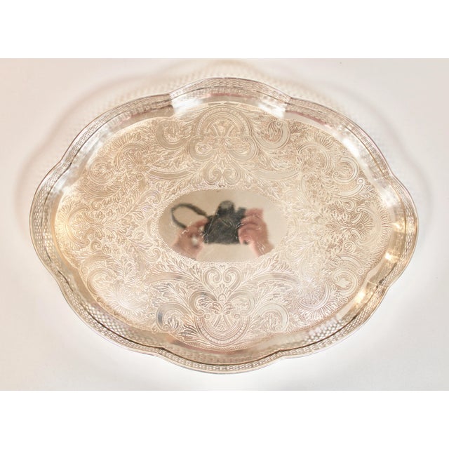 A stunning mid 20th century French silver plate serpentine tray with a lovely pierced gallery and ornate design. This is...