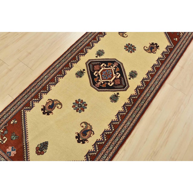 An authentic vintage traditional Kashmar runner hand-knotted with fine wool and natural dyes. This intricately woven...