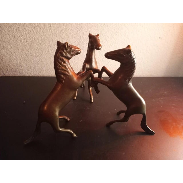 This is a Solid Bronze 7" Triple Rearing Stallion Sculpture. Great as Coffee Table decor Procured at auction
