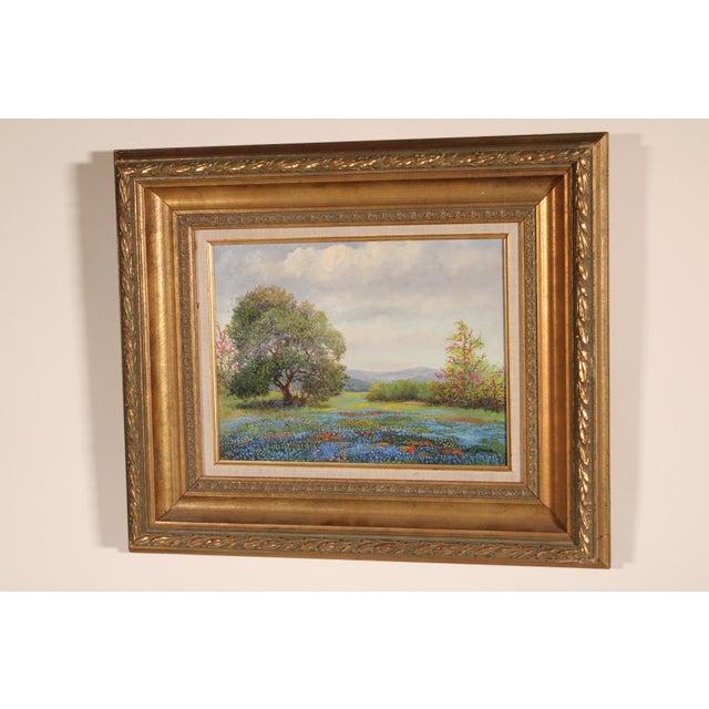 Painting of Texas blue bonnets by Ruth Greer (1936-2004). Titled on verso "Cloudy Afternoon". Oil on canvas. Frame...