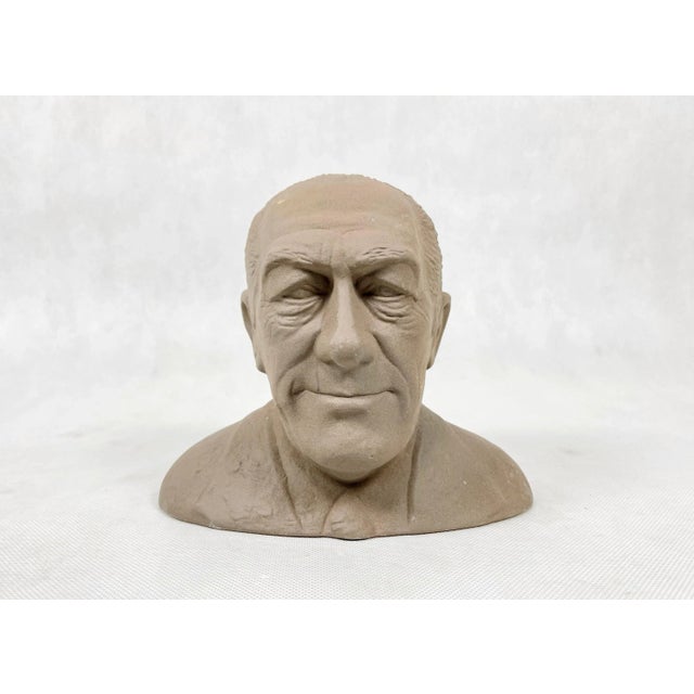 A ceramic money coin bank in the shape of a bust of the left-wing MP Hilmar Baunsgaard, manufactured by Soholm Ceramics as...