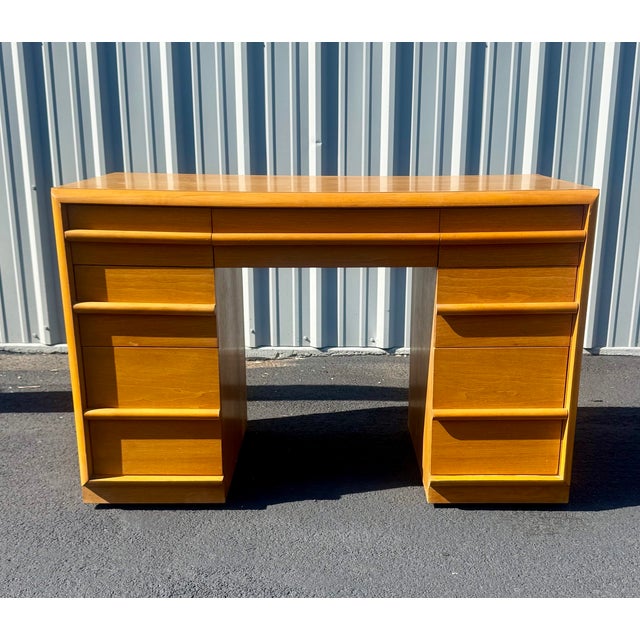 Exceptional mid-century modern writing desk designed by T.H. Robsjohn-Gibbings for Widdicomb, Model 1672. Crafted in...