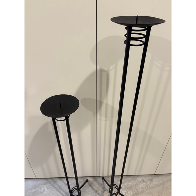 Vintage post modern floor candle holders stands. Metal tripod base with ball feet and atomic rings at top and bottom. Cool...