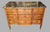 A louis xv–louis xvi transition period commode, circa 1770–1775, veneered with geometric marquetry. it opens with three...