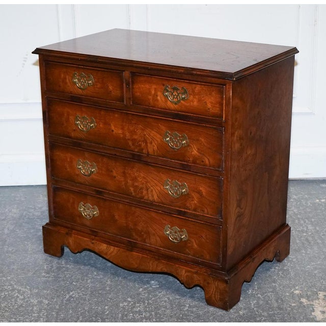 Elevate your interior with this beautifully crafted vintage 1950s burl elm chest of drawers, designed in the elegant...
