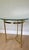 A striking vintage cocktail or occasional table in a distinctive Mid-Century Italian style, featuring an architectural...