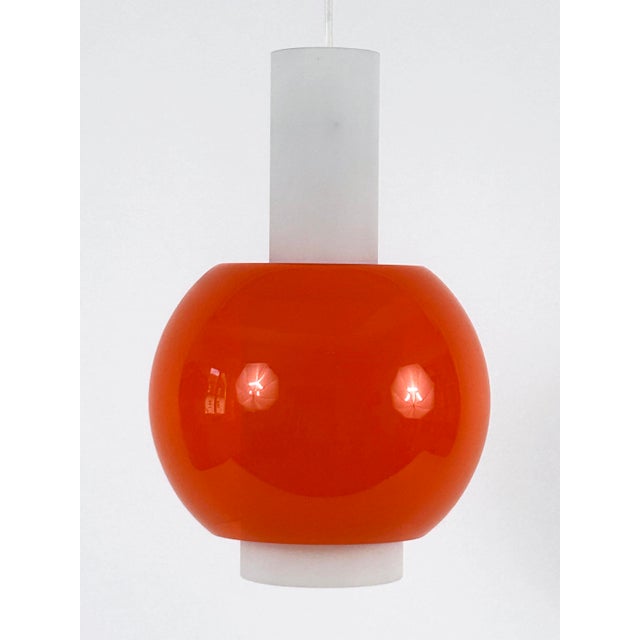 Extremely rare, highly decorative and elegant mid-century modern pendant lamp or hanging light. Designed and manufactured...