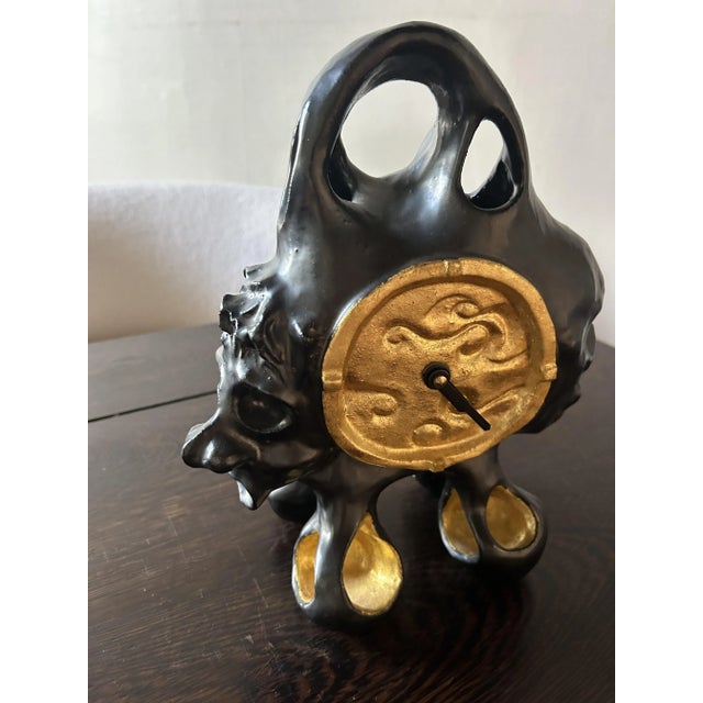 Rare Elizabeth Garouste clock in matte black and gold ceramic. Very good condition, no cracks or chips. Signed EG on the...