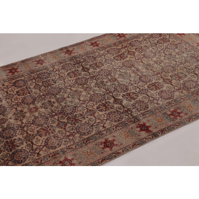 Hand-knotted in wool and originating circa 1950-1960, this 4x7 vintage rug is a sophisticated addition to Rug & Kilim’s...